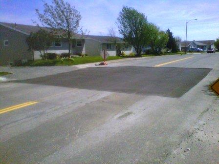 Road section cut out and being repaired