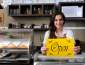 Businesswoman holding a sign that says open